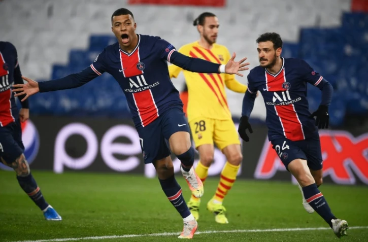 L'attaquant du Paris-SG, Kylian Mbappé, exulte après avoir ouvert le score sur penalty lors du 8e de finale retour de la Ligue des champions contre Barcelone, au Parc des Princes, le 10 mars 2021