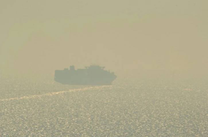 Un cargo, le premier empruntant les nouvelles voies maritimes en mer Noire, quitte le port d'Odessa, le 16 août 2023 dans le sud de l'Ukraine