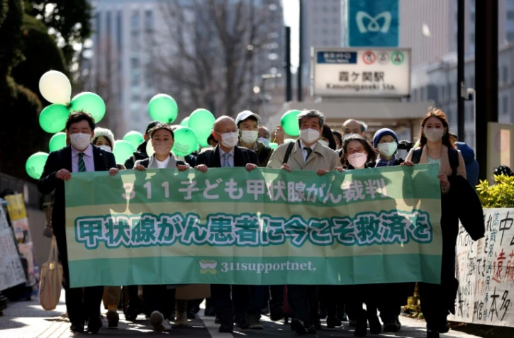 Manifestation en faveur de l'action collective en justice d'habitants de Fukushima atteints de cancers, le 27 janvier 2022 à Tokyo