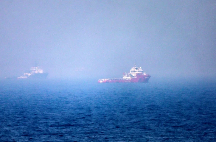 Des navires dans le détroit d'Ormuz, au large de Khor Fakkan, aux Emirats arabes unis, le 13 juillet 2026