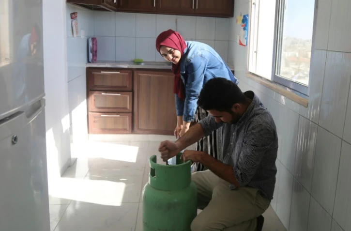 Rahmé Jaafar a participé aux manifestations en Jordanie. Employée dans une ONG, elle est obligée de faire en plus de petits boulots pour survivre. Son fiancé, chef cuisinier, doit lui aussi donner des cours de plongée ou d'escalade pour assurer les fins de mois. Photo prise dans leur appartement le 9 juin 2018