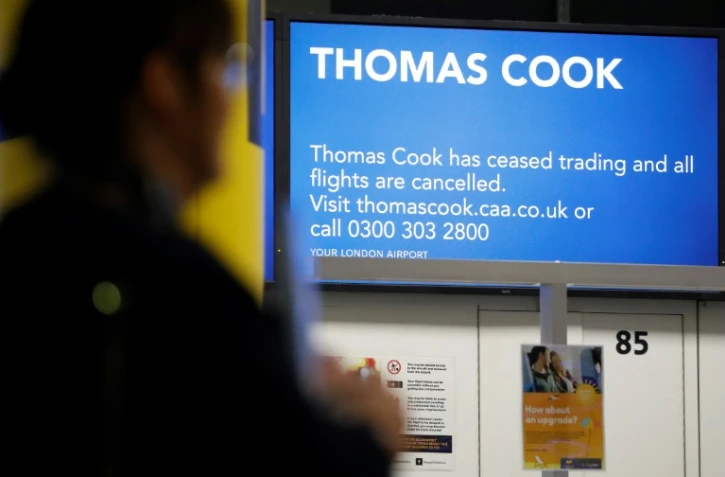 Le pionnier des voyagistes, le britannique Thomas Cook, a brutalement fait faillite lundi - Ici, le comptoir d'enregistrement de la compagnie à l'aéroport londonien de Gatwick le 23 septembre 2019