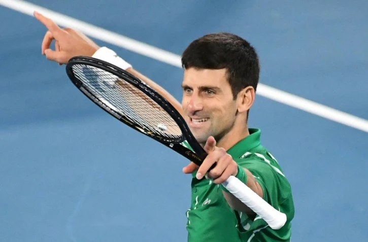 La joie du Serbe Novak Djokovic après sa victoire face à l'Autrichien Dominique Thiem en finale de l'Open d'Australie, le 2 février 2020 à Melbourne