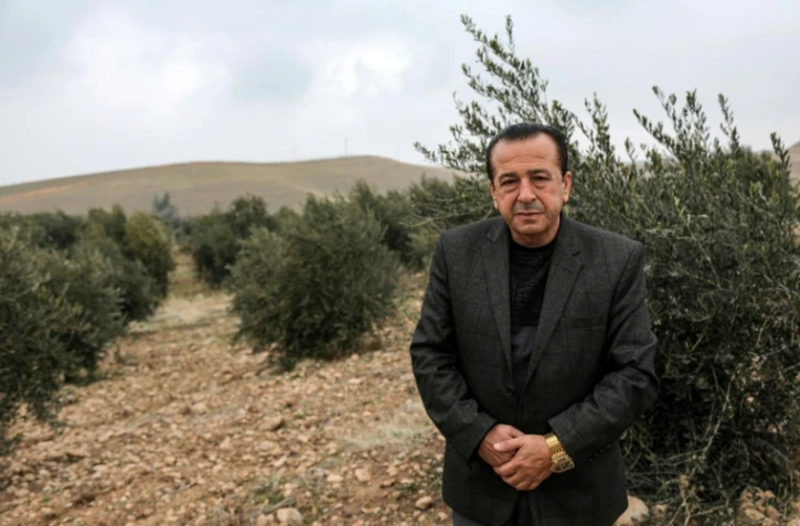 Suleiman Sheikho, dans son champ d'oliviers à Arbil dans le Kurdistan irakien, le 22 février 2020