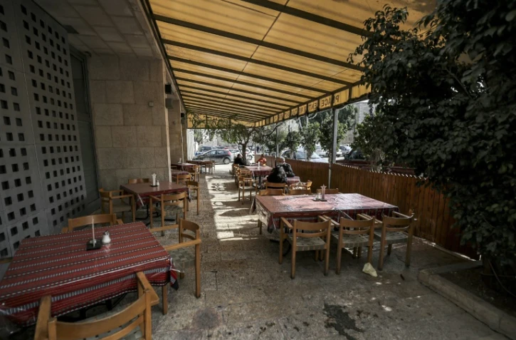 Restaurant désert à Bethléem, en Cisjordanie, en pleine haute saison touristique d'avant-Noël pour cause de pandémie de Covid-19, le 15 décembre 2022