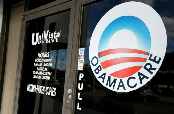 Le logo Obamacare sur la vitrine d'une agence d'assurance santé, le 10 janvier 2017 à Miami, en Floride