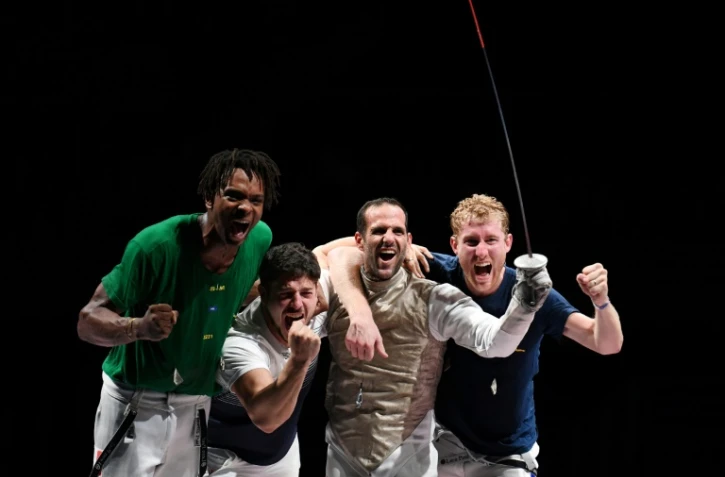 La joie des fleurettistes français Enzo Lefort, Maxime Pauty, Erwann Le Pechoux et Julien Mertine, champions olympiques, après leur victoire face à la Russie, le 1er août 2021 aux Jeux Olympiques de Tokyo 2020