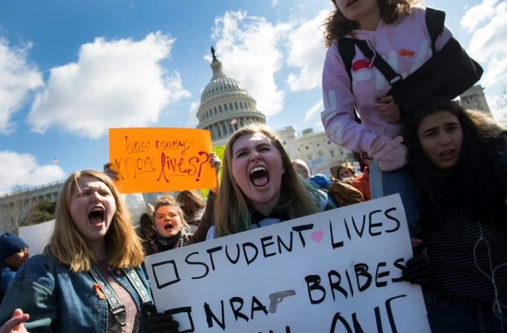 Des lycéens participent le 14 mars 2018 à Washington à un rassemblement en hommage aux victimes de la fusillade de Parkland  