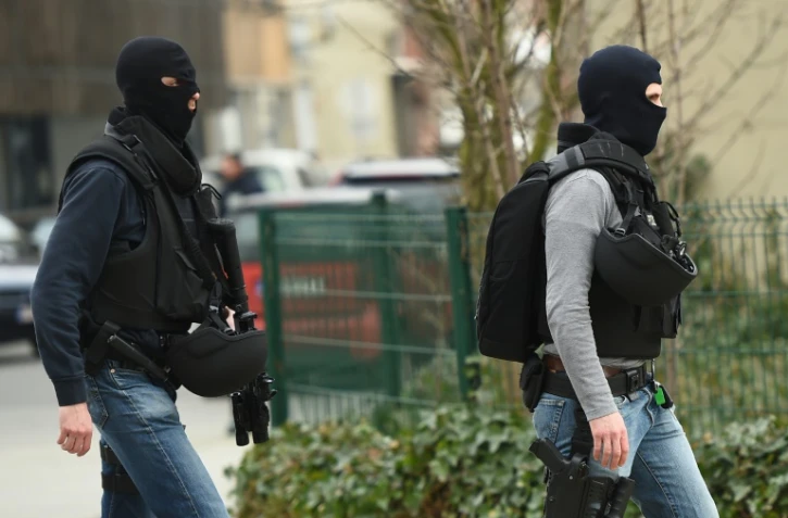 Des policiers des forces spéciales belges à proximité de la zone des fusillades à Bruxelles, le 15 mars 2016