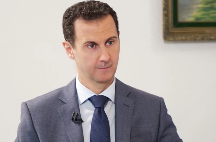 Le président syrien Bachar al-Assad, sur une photo publiée le 8 décembre 2016 par l'agence officielle syrienne SANA