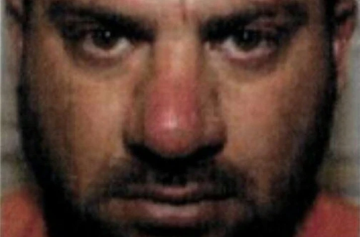 Gros plan sur le visage d'Abou Ibrahim al-Hachimi al-Qourachi, l'ex-chef du groupe Etat islamique (EI), diffusé le 17 juillet 2020 par le Département d'Etat américain