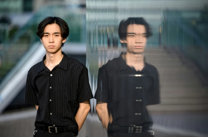 Le jeune activiste hongkongais, Wong Yat-chin, qui a créé une association nommée "Student Politicism" en 2020, à Hong Kong lors d'une interview avec l'AFP, le 14 juillet 2021
