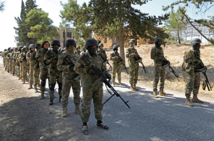 Syrian rebel fighters prepare for an upcoming government forces offensive, in the countryside of the rebel-held northern Idlib province