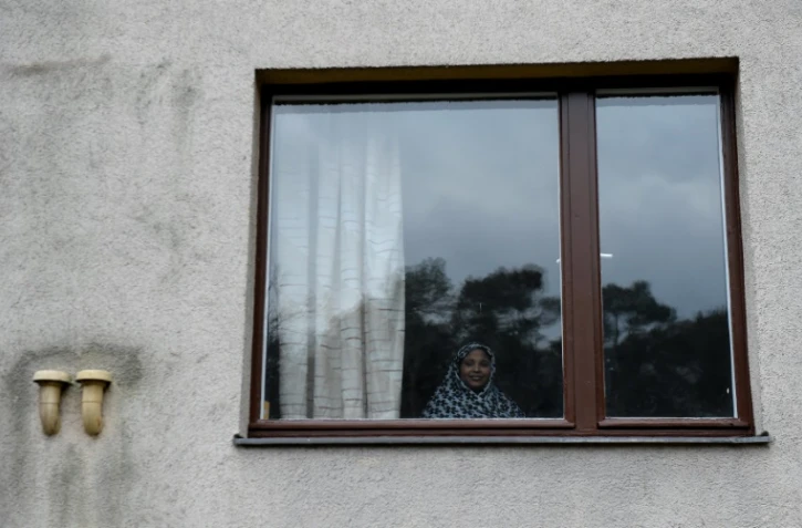 Une femme qui a fui son pays a trouvé refuge dans un centre pour demandeurs d'asile, le 3 mars 2016, à Berlin