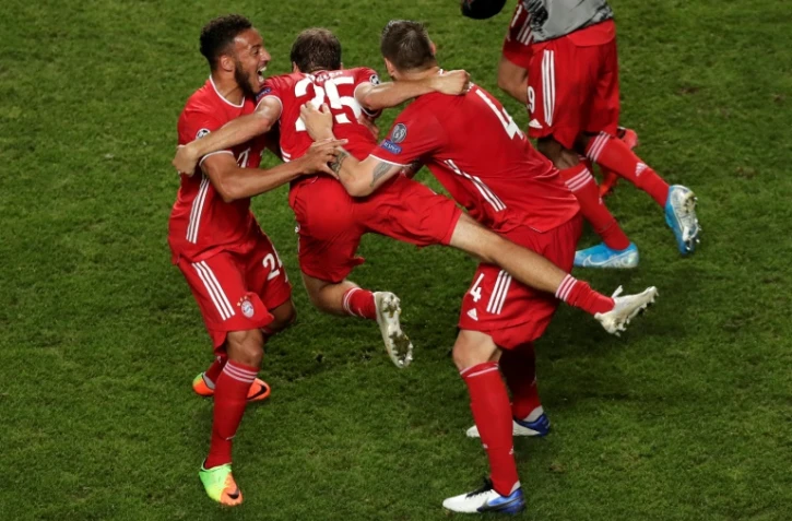 Les joueurs du Bayern Munich exultent à l'issue de leur victoire contre le PSG en finale de Ligue des champions à Lisbonne, le 23 août 2020