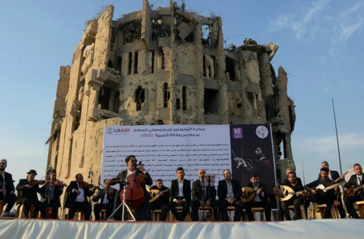 Concert de Karim Wasfi, un célèbre musicien irakien, dans la vieille ville en ruines de Mossoul (Irak), le 10 novembre 2018