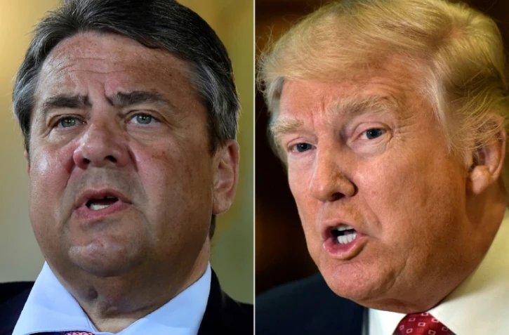 Le chef de la diplomatie allemande, Sigmar Gabriel (g), a estimé lundi que les actions du président américain Donald Trump (d) avaient "affaibli" l'Occident et accusé la politique des Etats-Unis d'être contraire "aux intérêts de l'Union européenne".