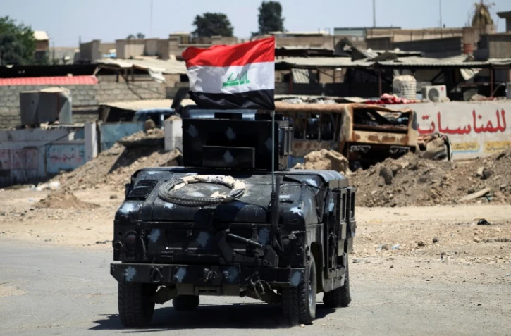 Un véhicule des forces irakiennes en patrouille près de la vieille ville de Mossoul, le 24 mai 2017