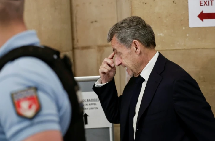 L'ancien président Nicolas Sarkozy arrive au palais de justice de Paris, le 8 avril 2026, pour son procès en appel dans l'affaire du financement libyen de sa campagne électorale de 2007