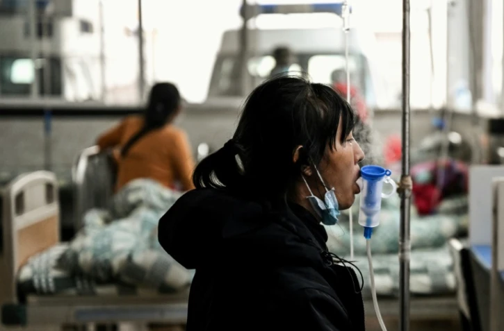 Une malade du Covid-19 dans un hĂ´pital de Jinghong, dans la province du Yunnan (sud de la Chine) le 9 janvier 2023