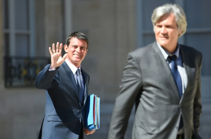 Le Premier ministre Manuel Valls et le ministre de l'Agriculture et porte-parole du gouvernement Stéphane Le Foll le 22 août 2016 à la sortie de l'Elysée à Paris