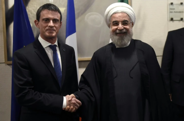 Hassan Rohani et Manuel Valls au siège du Medef à Paris le 28 janvier 2016