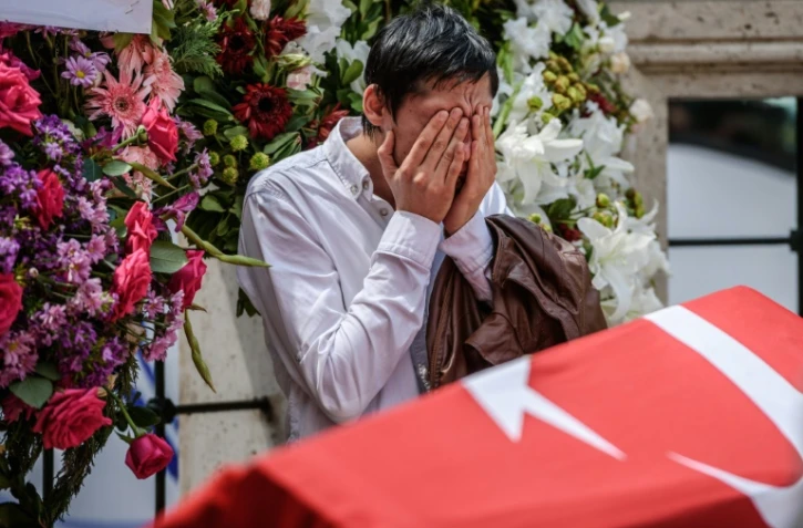 Recueillement après l'attentat: parmi les victimes, quatre personnes d'une même famille ont été tuées