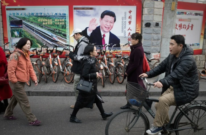 Une affiche de propagande montrant le président chinois Xi Jinping, sur un mur de Pékin le 12 mars 2018