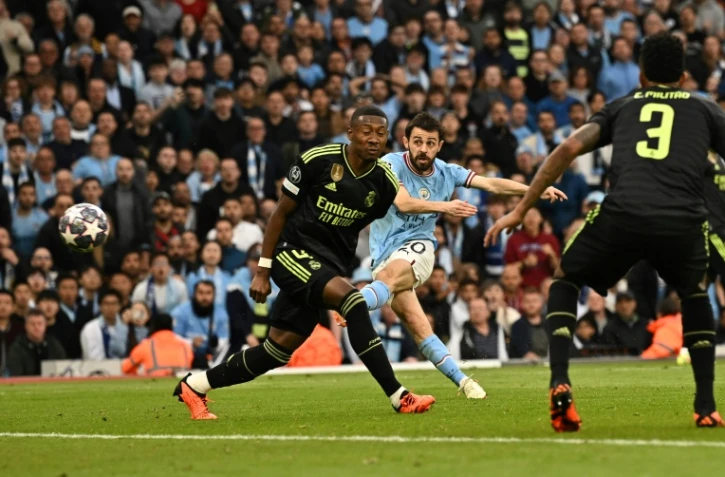 L'attaquant de Manchester City Bernardo Silva (c) ouvre la marque contre le Real Madrid en demi-finale retour de Ligue des champions, le 17 mai 2023 à Manchester  