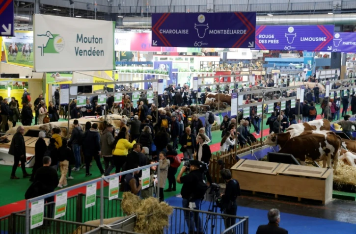 Des exposants au 60ème Salon de l'Agriculture, le 26 février 2024 à Paris
