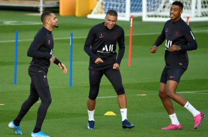 La pépite du PSG Kylian Mbappé, à l'entraînement avec Presnel Kimpembe et Layvin Kurzawa, le 17 octobre 2019 au Camp des Loges