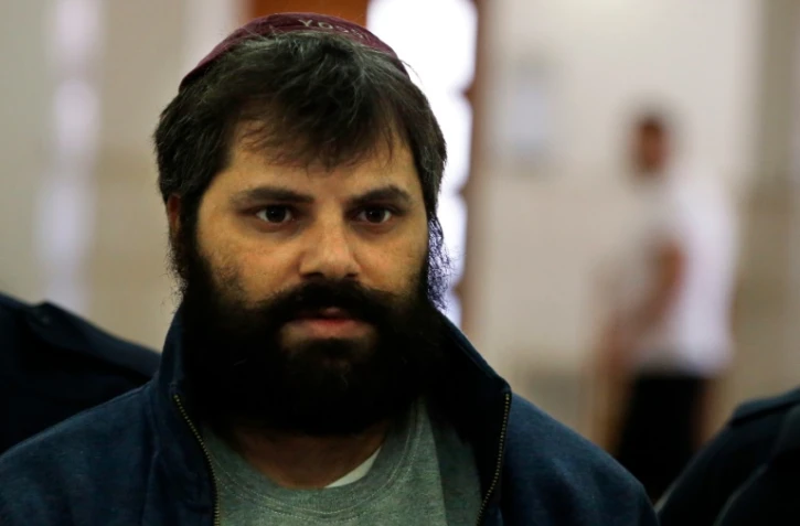 Yosef Haim Ben-David, principal accusé dans le meurtre d'un adolescent palestinien brûlé vif en 2014, à son arrivée le 22 mars 2016 au tribunal à Jérusalem pour une expertise psychiatrique