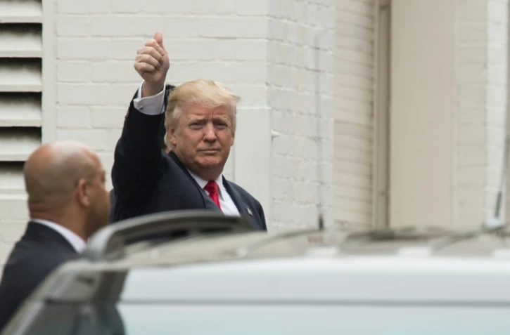 Le candidat à la  Maison Blanche Donald Trump lors de son arrivée à une réunion avec des chefs du parti républicain, le 12 mai 2016 à Washington