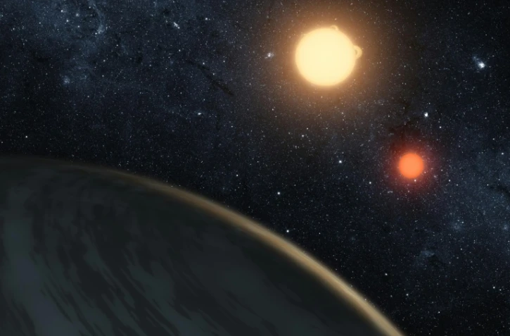 Un dessin réalisé par la Nasa de la planète Kepler-16b, qui tourne autour de deux étoiles