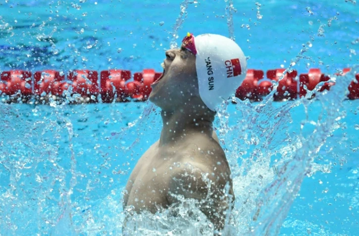 Le Chinois Sun Yang exulte apèrs avoir remporté son 4e titre mondial au 400 m nage libre aux Mondiaux de natation, le 21 juillt 2019 à Gwangju