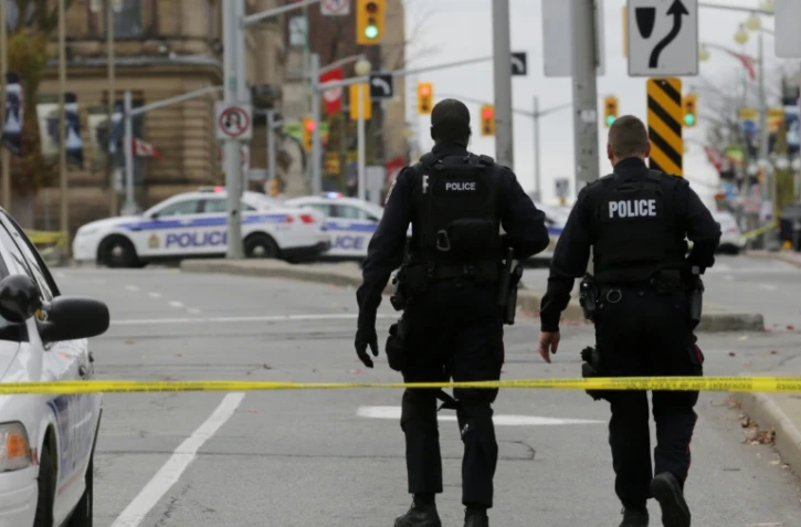 Des policiers le 22 octobre 2014 à Ottawa où un soldat a été tué près du Parlement