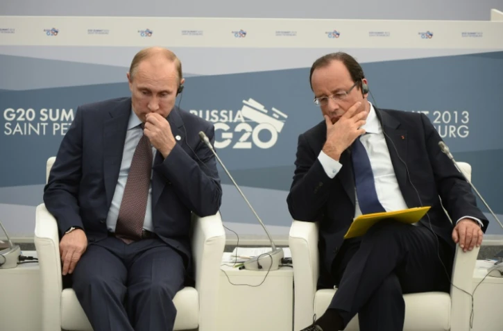 Les présidents français et russe, François Hollande (D) et Vladimir Poutine durant le sommet du G20 à Saint-Pétersbourg, le 6 septembre 2013