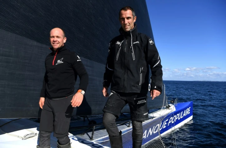 Les skippers français Kevin Escoffier (g) et Armel Le Cleac'h, à bord de leur Ultim "Maxi Banque Populaire XI", lors d'un entraînement pour la  Transat Jacques Vabre, course en double à destination de la Martinique, dont le départ est prévu le 7 novembre 2021 au Havre