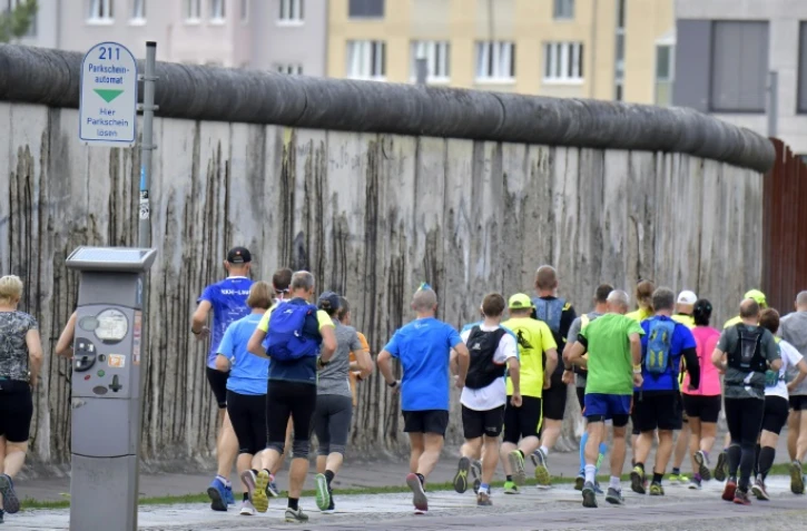 Des participants de l'ultra-marathon de la mémoire s'entraînent à la veille de la course, à Berlin le 16 août 2019