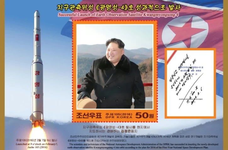 Photo non datée d'un timbre célèbrant le lancement du satellite Kwangmyongsong-4. Photo diffusée le 1er mars 2016 par l'agence nord-coréenne KCNA
