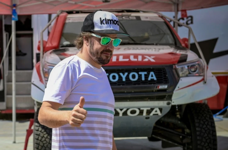 L'ancien pilote espagnol de F1, Fernando Alonso, lors du Lichtenburg 400, un rallye-raid organisé en Afrique du Sud, à Lichtenburg, le 13 septembre 2019
L'ancien pilote espagnol de F1 Fernando Alonso lors d'une épreuve de rallye cross Lichtenburg 400, un rallye-raid organisé en Afrique du Sud , le 13 septembre 2019 à Lichtenburg en Afrique du Sud
