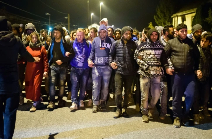 Migrants et réfugiés à leur arrivée le 20 octobre 2015 dans un centre à Sentilj à la frontière entre la Slovénie et l'Autriche
