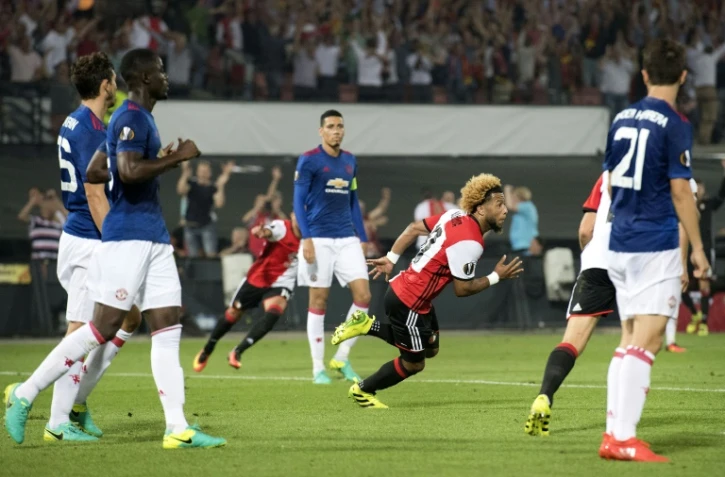 Les joueurs de Manchester United sonnés après le but de Tonny Trindade du Feyenoord (c) en Europa League, le 15 septembre 2016 à Rotterdam