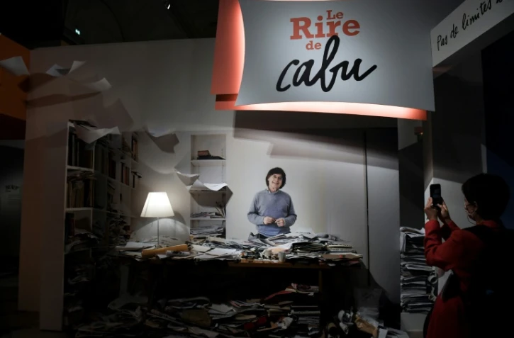 Un photo de Cabu dans son bureau, visible à l'exposition "Le rire de Cabu", à l'Hôtel de Ville de Paris, le 8 octobre 2020
