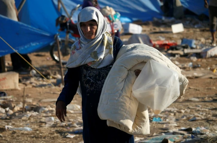 Photo prise dans un camp de déplacés syriens, le 2 juillet 2018, dans la région de Nassib (sud de la Syrie)
