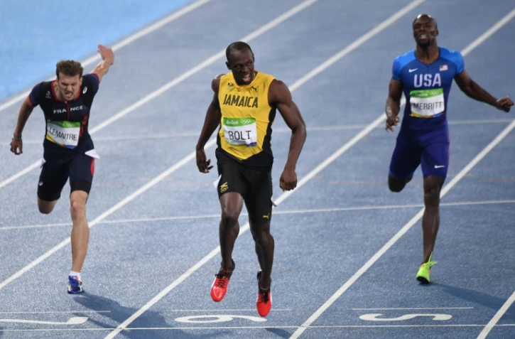 Usain Bolt vainqueur du 200 m et Christophe Lemaitre (g), médaillé de bronze, lors des JO de Rio le 18 août 2016