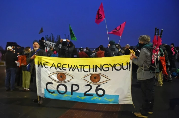 Des militants d'Extinctin Rebellion manifestent pendant la COP26, le 8 novembre 2021 à Glasgow, en Ecosse