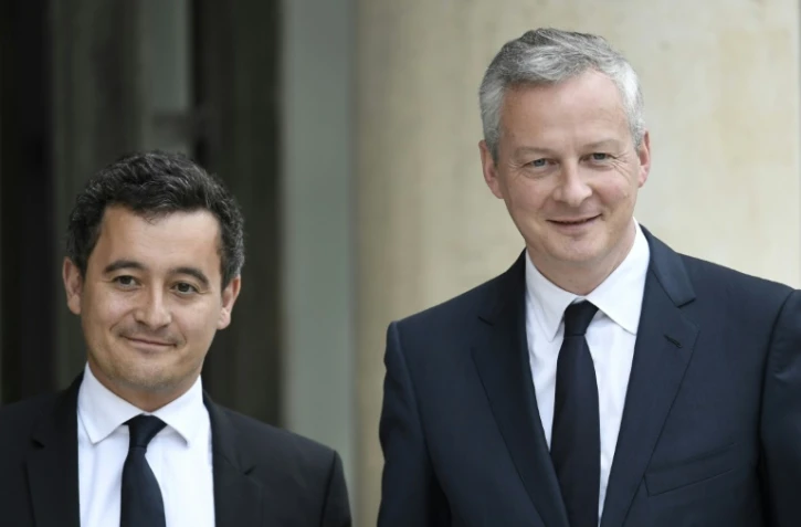 Le ministre de l'Economie Bruno Le Maire (d) et le ministre de l'Action et des Comptes publics Gérald Darmanin (g), à l'Elysée, avant le premier Conseil des ministres du gouvernement, le 18 mai 2017