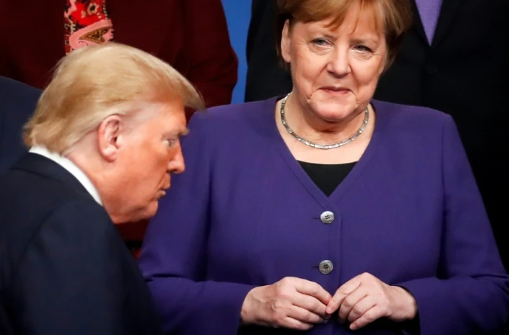 La chancelière allemande Angela Merkel (d)et le président américain Donald Trump, lors d'un sommet de l'Otan à Watford, le 4 décembre 2019 au Royaume-Uni