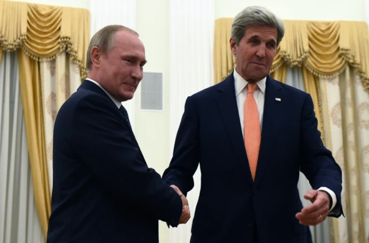 Le président Vladimir Poutine et le secrétaire d'Etat américain John Kerry le 14 juillet 2016 au Kremlin à Moscou